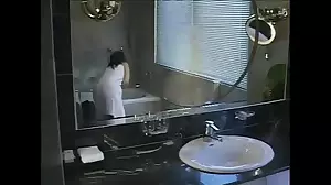 A young Thai brunette stretches her tight ass in the bathroom