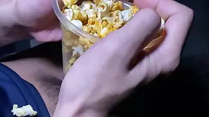 Young Asian teen gives a handjob and blowjob with popcorn