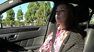 Experience a thrilling POV video of a tattooed teen giving a passionate blowjob in a car